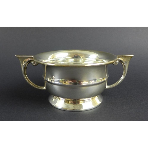 759 - An unusual Victorian silver pepper pot, the curved body chased and embossed with scrolls and foliage... 