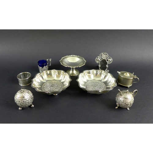 763 - A pair of Mexican silver bon bon dishes with shaped upper rims, the bases with chased and embossed A... 