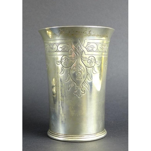 766 - A group of Victorian and later silver items comprising a beaker engraved with strap work design and ... 