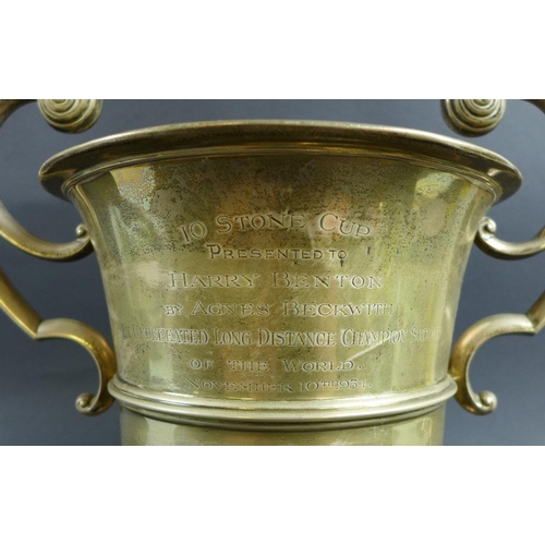 767 - A large Edward VII silver trophy, the urn form body with two scroll handles, engraved '10 Stone Cup,... 