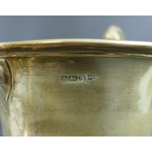 767 - A large Edward VII silver trophy, the urn form body with two scroll handles, engraved '10 Stone Cup,... 