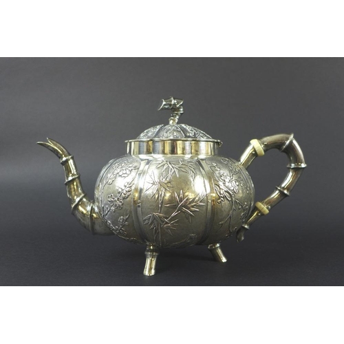 770 - A Chinese Export four piece silver tea service including tray, circa 1900, each of lobed melon form ... 