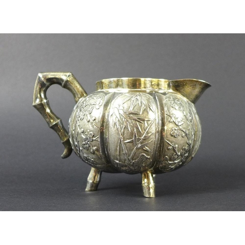 770 - A Chinese Export four piece silver tea service including tray, circa 1900, each of lobed melon form ... 