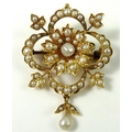 A gold and seed pearl brooch of quatrefoil form with central flower and pearl drop, pin and loop to ... 