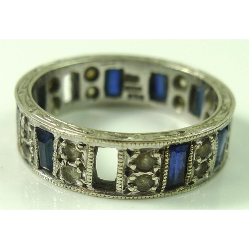 797 - A 9ct white gold eternity ring set with baguette cut sapphires alternating with white stones, Englis... 