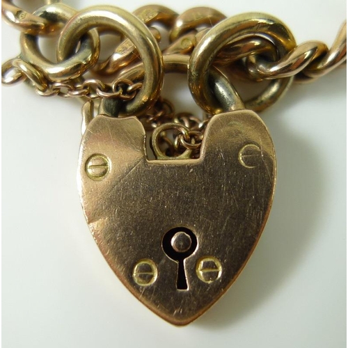 798 - A 9ct gold curb chain bracelet with heart padlock clasp, each link individually stamped 9 and 375, c... 