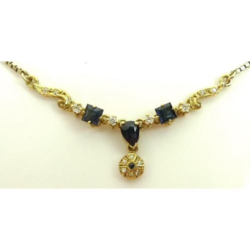 799 - An 18ct gold necklace set with blue and white stones, possibly sapphires, marked MD 750 Spain 18kt, ... 