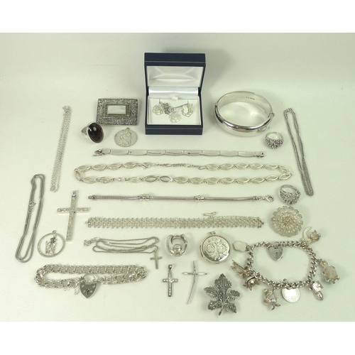 800 - A collection of silver costume jewellery, including rings, necklaces, bracelets, pendants, crosses a... 