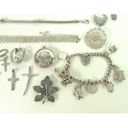 800 - A collection of silver costume jewellery, including rings, necklaces, bracelets, pendants, crosses a... 