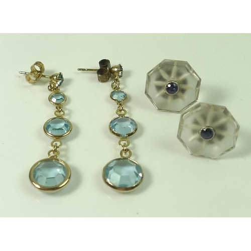 811 - A pair of drop earrings each set with four aquamarines of graduated size, 4 cm in length, with 9ct g... 