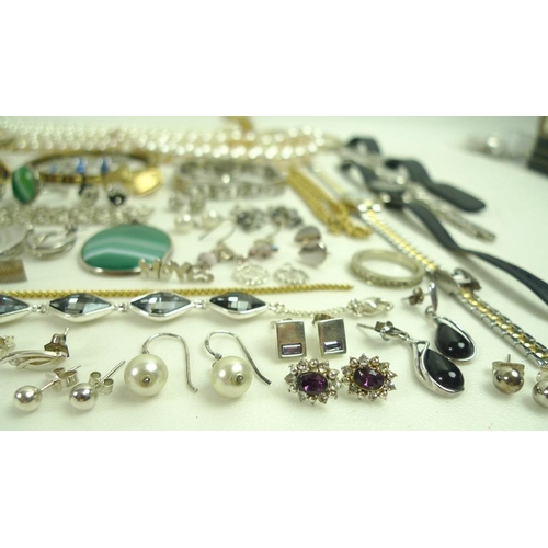 812 - A collection of silver and costume jewellery, including a large collection of silver stud earrings, ... 