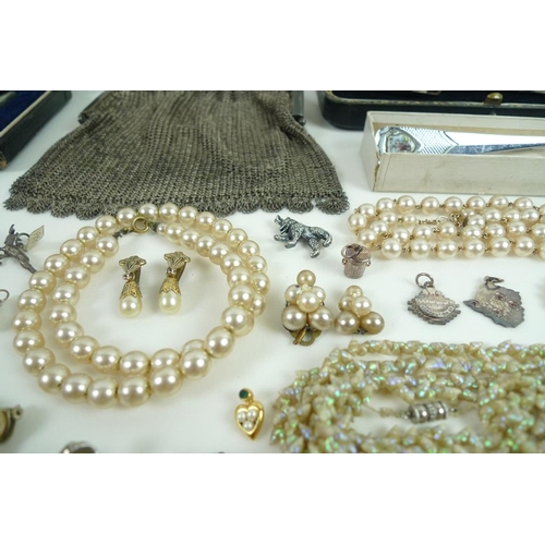 815 - A collection of jewellery including two silver charm bracelets with charms and further loose charms,... 