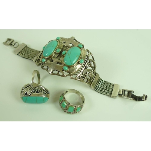 818 - A Mexican silver cuff set with turquoise cabochons, together with two similar silver and turquoise r... 