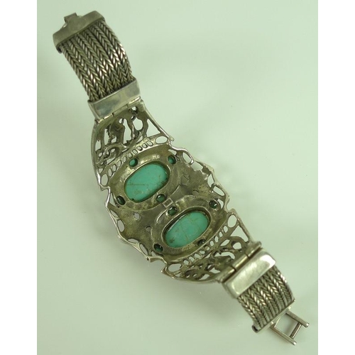 818 - A Mexican silver cuff set with turquoise cabochons, together with two similar silver and turquoise r... 