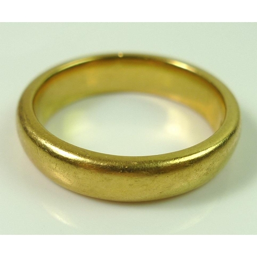 826 - A 22ct gold wedding band, hallmarked, size L, 7.8g.