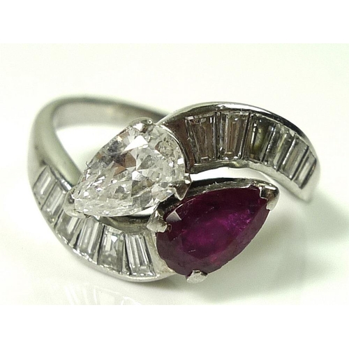 827 - A platinum crossover ring set with a pear cut diamond, approx 0.5ct, and pear cut ruby, of similar s... 