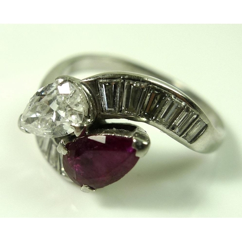 827 - A platinum crossover ring set with a pear cut diamond, approx 0.5ct, and pear cut ruby, of similar s... 