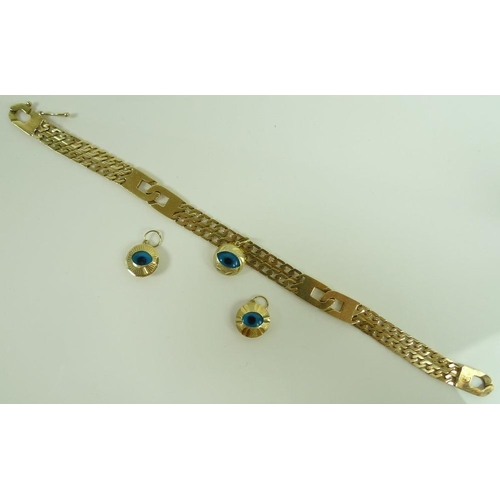 832 - A Turkish 14ct gold bracelet with blue glass evil eye charm, marked 585, tested, with two further ev... 