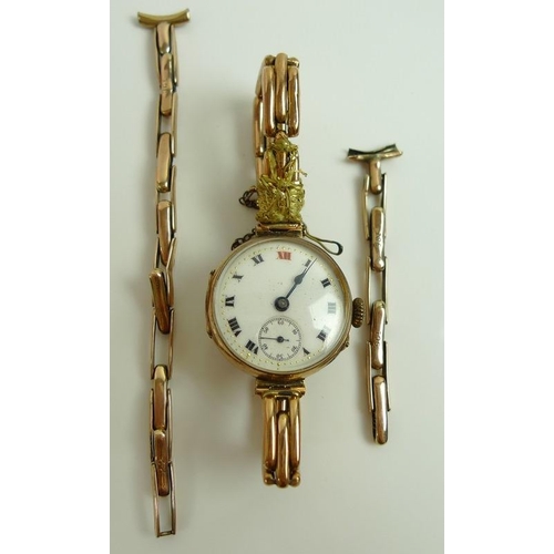 833 - A lady's 9ct gold wristwatch, the white enamel dial with Roman numerals and subsidiary seconds dial,... 