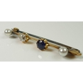 A gold bar brooch set with an old rose cut diamond, approx 0.45ct, a sapphire, and two white pearls,... 