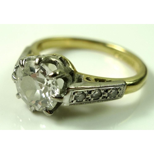 849 - A diamond solitaire ring, the central diamond approximately 1.2ct, 6.57mm diameter by 4mm, flanked t... 