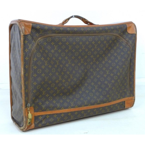 854 - A Louis Vuitton soft-sided travel bag, the leather top stamped with initials EDG, card label to inte... 