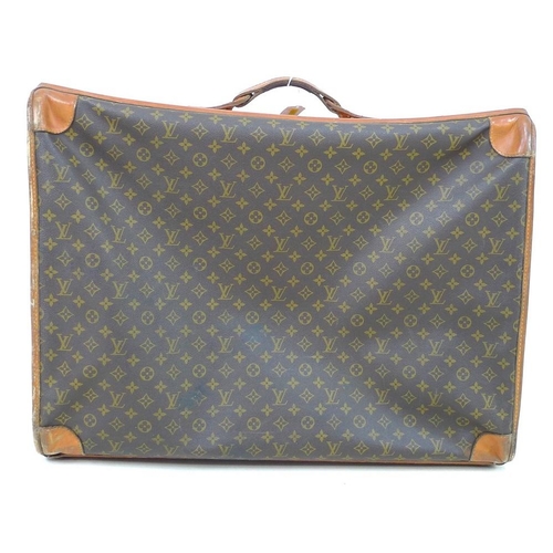 854 - A Louis Vuitton soft-sided travel bag, the leather top stamped with initials EDG, card label to inte... 