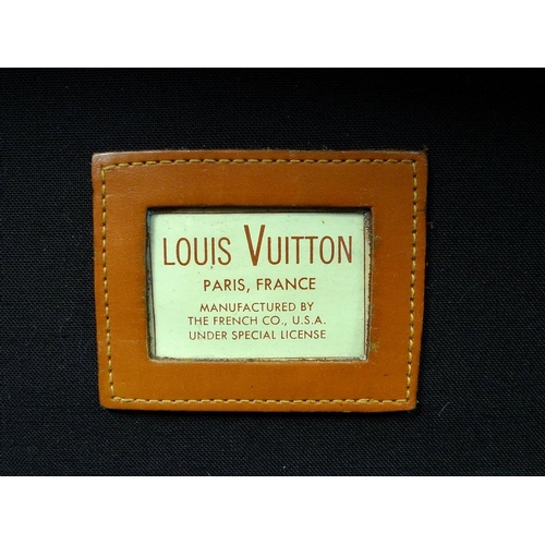 854 - A Louis Vuitton soft-sided travel bag, the leather top stamped with initials EDG, card label to inte... 