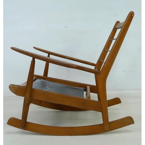 856 - A 1950's early model Scandart Ltd hardwood rocking chair, 84 by 66 by 80cm high.