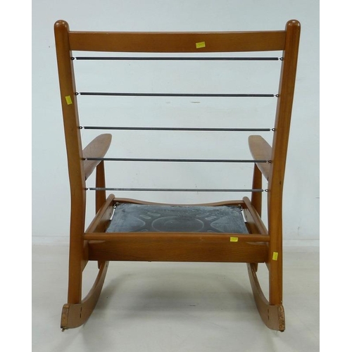 856 - A 1950's early model Scandart Ltd hardwood rocking chair, 84 by 66 by 80cm high.