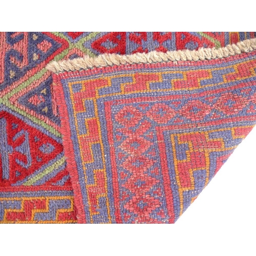 859 - A Gazak rug with red ground, diamond pattern to field in dark blue, light red and yellow, multiple b... 