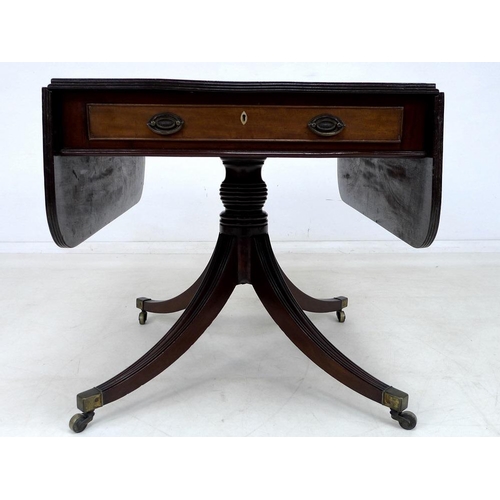 919 - A Regency mahogany sofa table, two frieze drawers with oval brass handles, diamond shaped ivory escu... 