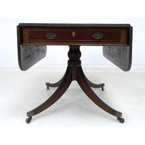 919 - A Regency mahogany sofa table, two frieze drawers with oval brass handles, diamond shaped ivory escu... 