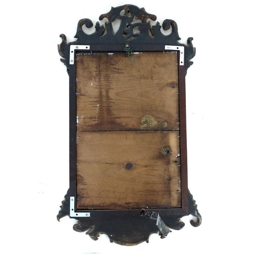 925A - A George III mahogany carved wall mirror, with eagle to the pediment amidst scrolling foliage and ca... 