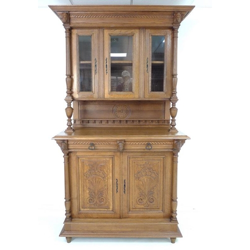 926 - A 19th century French oak glazed hunting cabinet / buffet a deux corps, the upper section with wide ... 