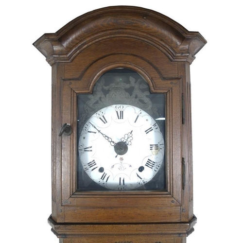 928 - A French 19th century oak tall long case clock, of tapering form with squared hood, the case carved ... 