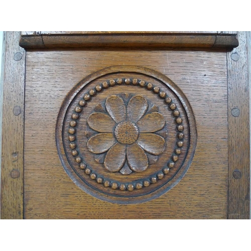 928 - A French 19th century oak tall long case clock, of tapering form with squared hood, the case carved ... 