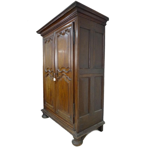 929 - A French Louis XVI fruitwood armoire, late 18th century, cavetto moulded cornice over twin panelled ... 