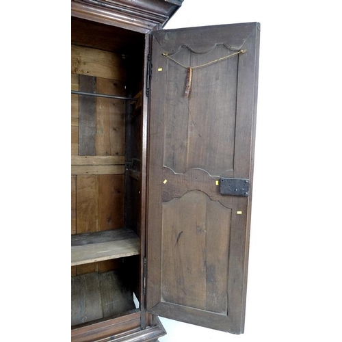 929 - A French Louis XVI fruitwood armoire, late 18th century, cavetto moulded cornice over twin panelled ... 