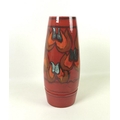 A large Poole Delphis vase with red ground and black and orange abstract design, 40cm high, together... 