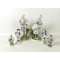 A pair of Meissen late 19th century porcelain figurines, one modelled as a flower seller, with impre... 
