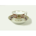 A Derby porcelain cup and saucer, circa 1810, decorated with red and purple floral border and gilt h... 