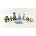 A group of Royal Copenhagen china figurines, comprising a cat, 13.5cm high, a boy with a brush, 11.8... 