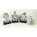 A collection of Lladro clown busts, comprising numbers 5610, 5611 and 5612, complete with wooden sta... 