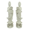A pair of Chinese blanc-de-chine porcelain figures, mid to late 20th century, each modelled as Guany... 