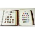 A collection of Victorian and later stamps in two burgundy stamp albums, first titled 'Vic - Geo IV ... 
