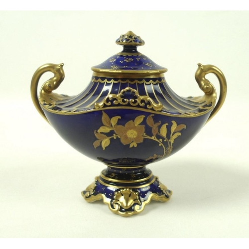 507 - A small late Victorian Royal Crown Derby porcelain twin handled urn and cover, decorated in gilt wit... 