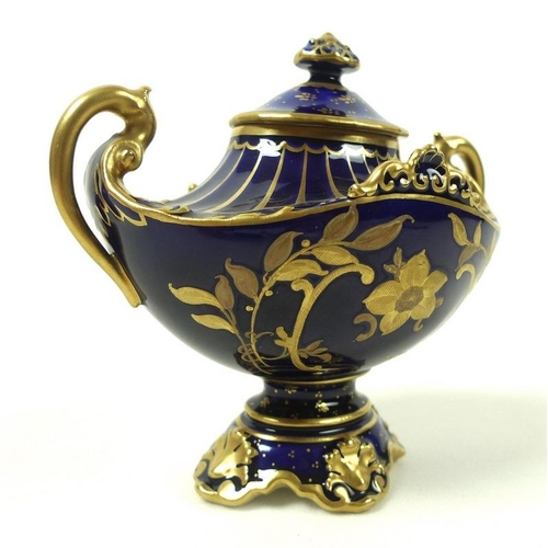 507 - A small late Victorian Royal Crown Derby porcelain twin handled urn and cover, decorated in gilt wit... 