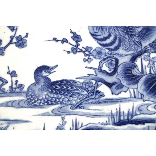 518 - A Chinese porcelain blue and white charger, early 20th century, decorated with two ducks amongst flo... 