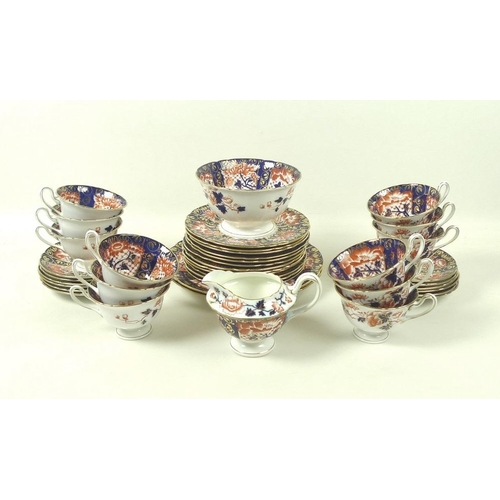 534 - A Foley China part tea service decorated in the Imari style, pattern number 9764, comprising twelve ... 